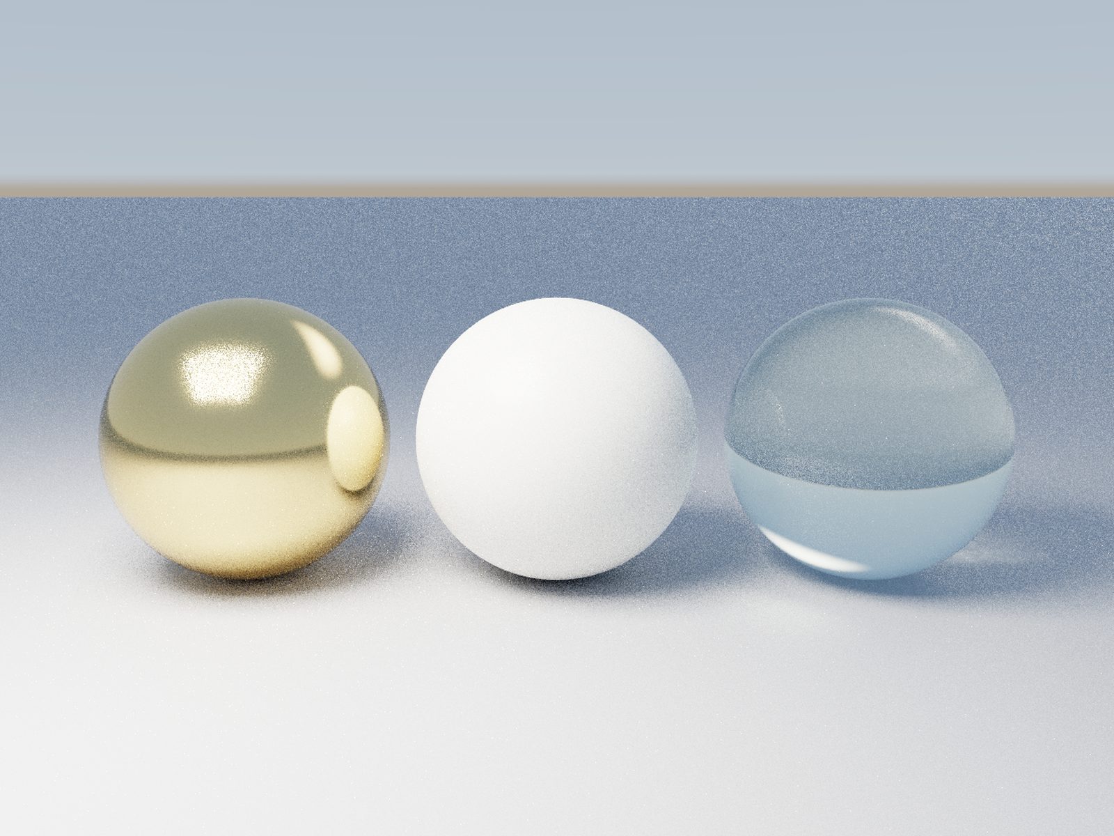 Gold, diffuse and glass spheres with caustics rendered in Lumasmith